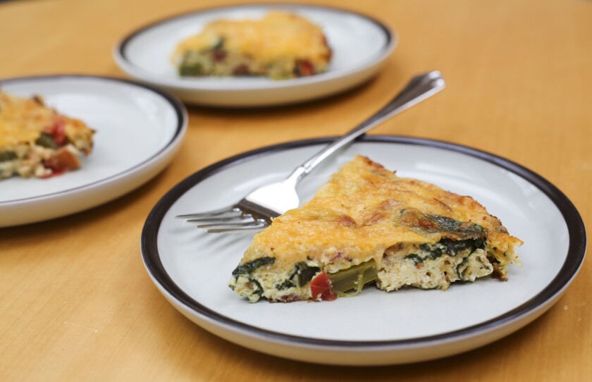 This egg bake includes eggs, spinach, cheese, bacon, mushrooms, asparagus, onions, garlic and tomatoes, which all cook in one pan. Erin Bormett / The Forum