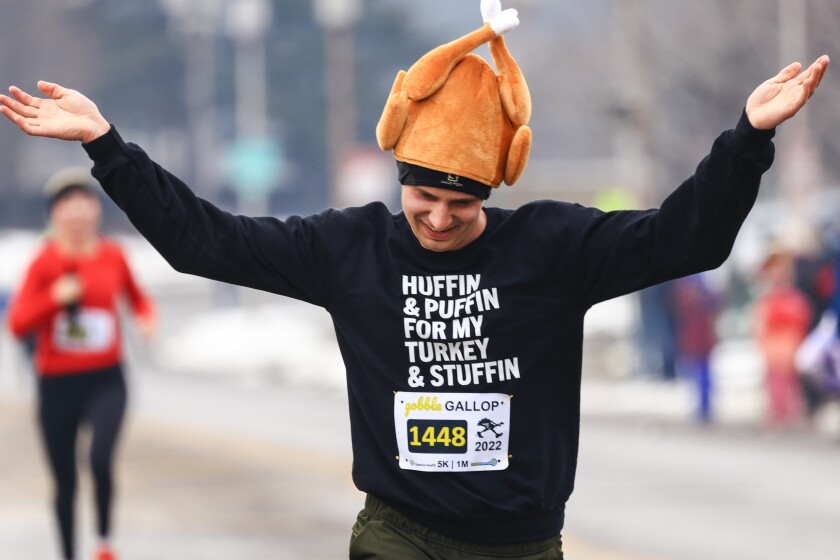 people running road race in Thankgiving themed clothing