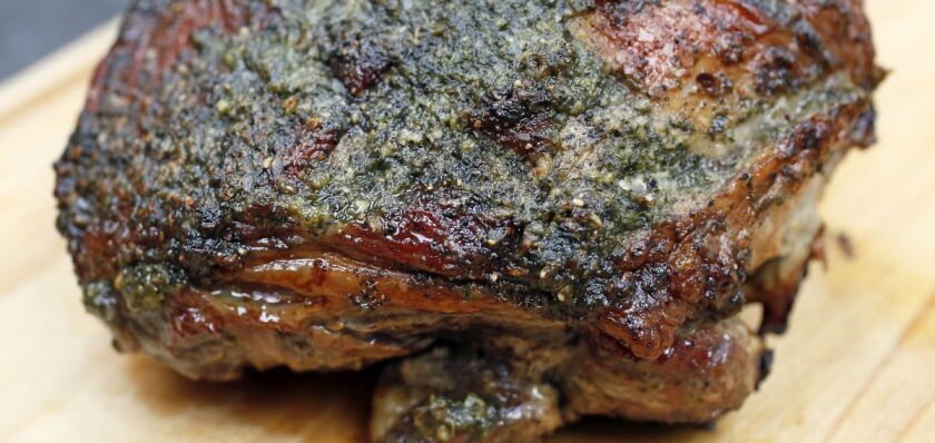 Roast leg of lamb with a fresh mint and garlic crust and roasted spring vegetables. David Samson / The Forum