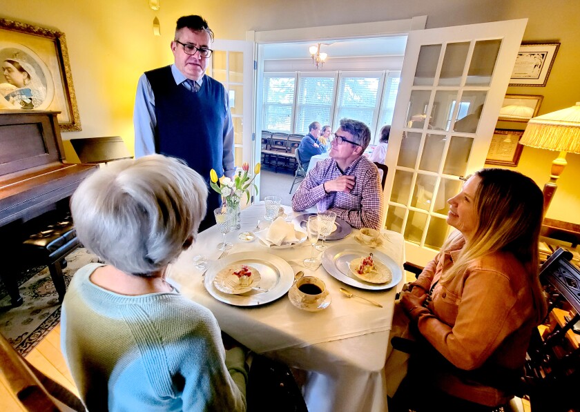 James Sheetz visits with guests during a Mother's Day private event at the Historic Scott House on Sunday, May 8, 2022, in Carlton, Minnesota.