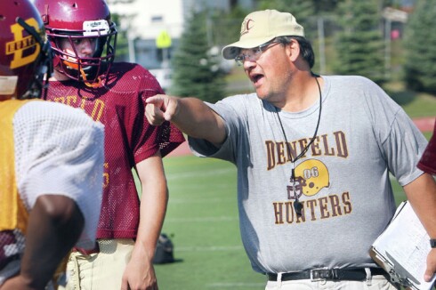 Huie gives pointers to his players
