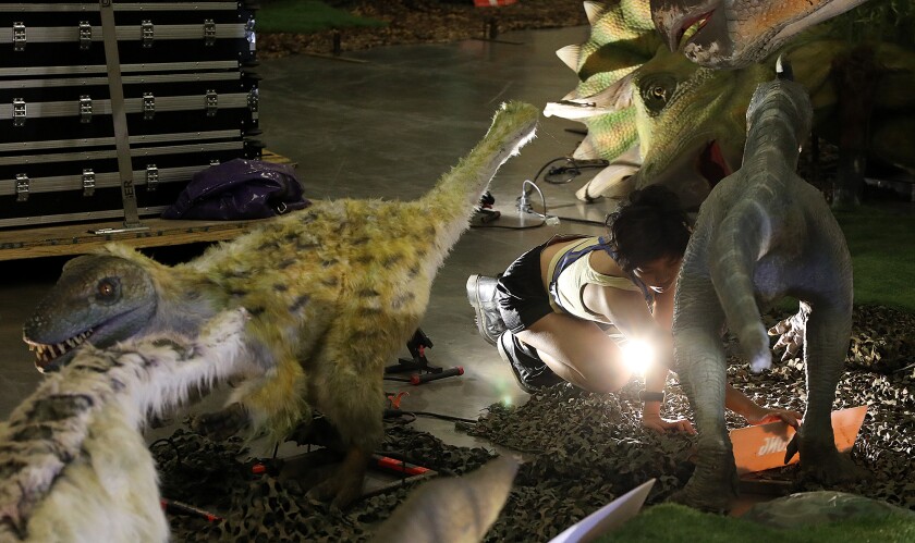 Xena Xelie adds a name plate under the Guanlong