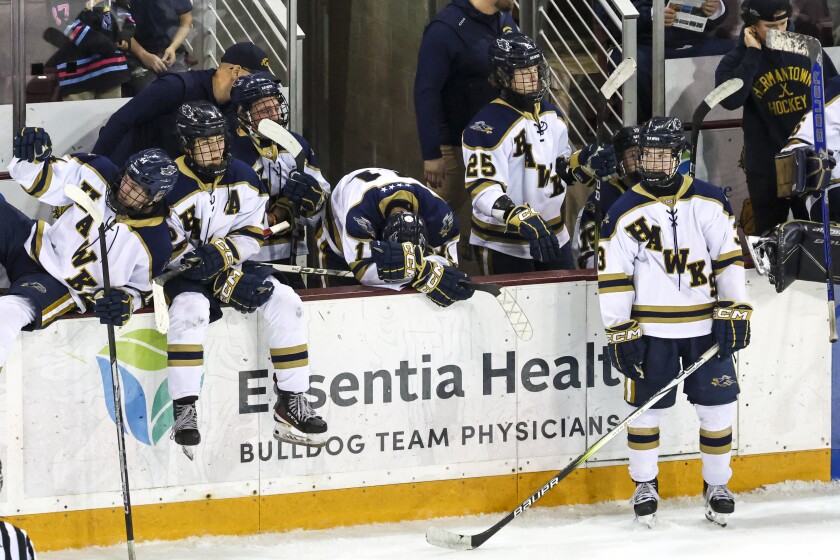 high school boys play ice hockey