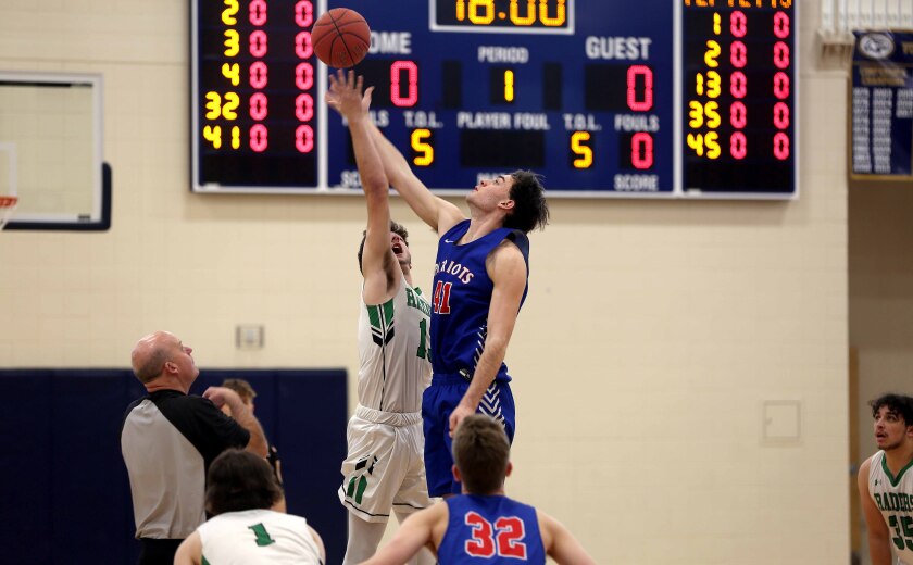 two players jump for the basketball