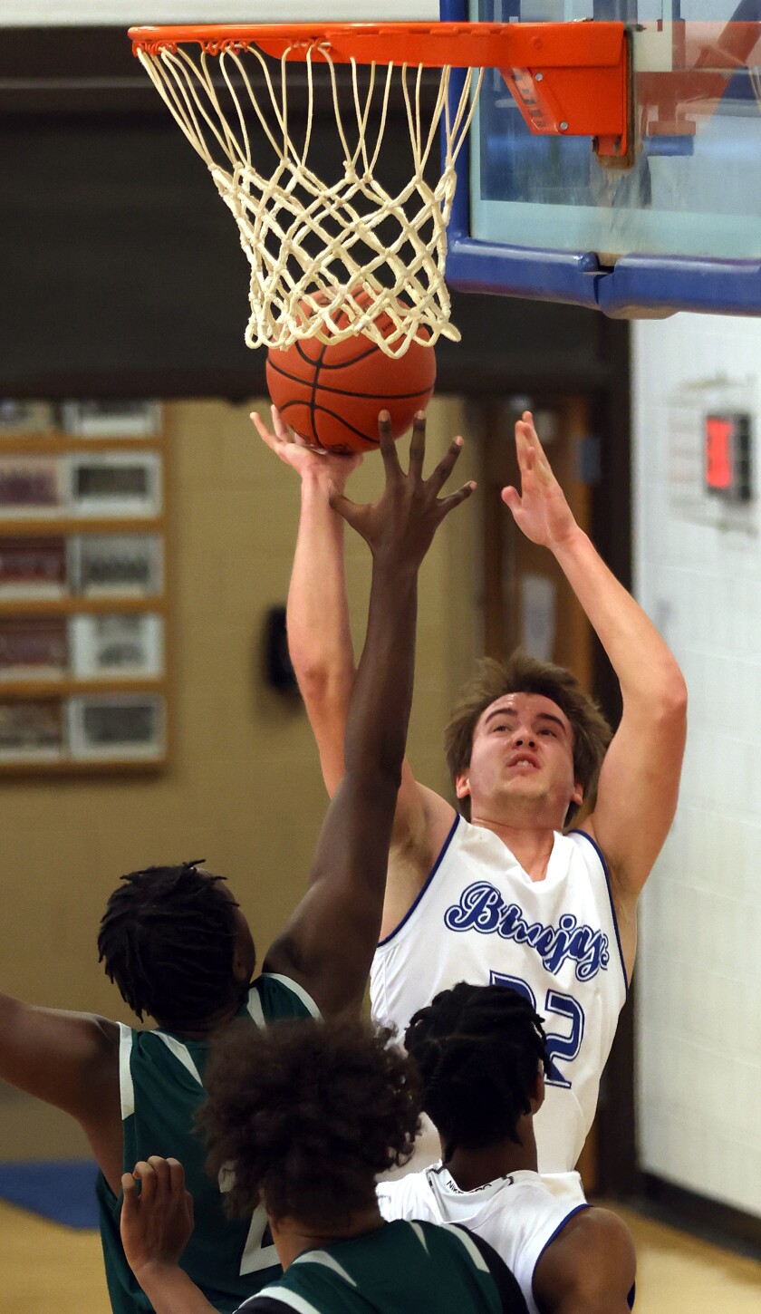 Minnesota West Blue Jays Sam Paulson's jump shot is Blocked by St. Cloud Technical & Community College Cyclones Lucky Moronge during Monday afternoon game in Worthington.