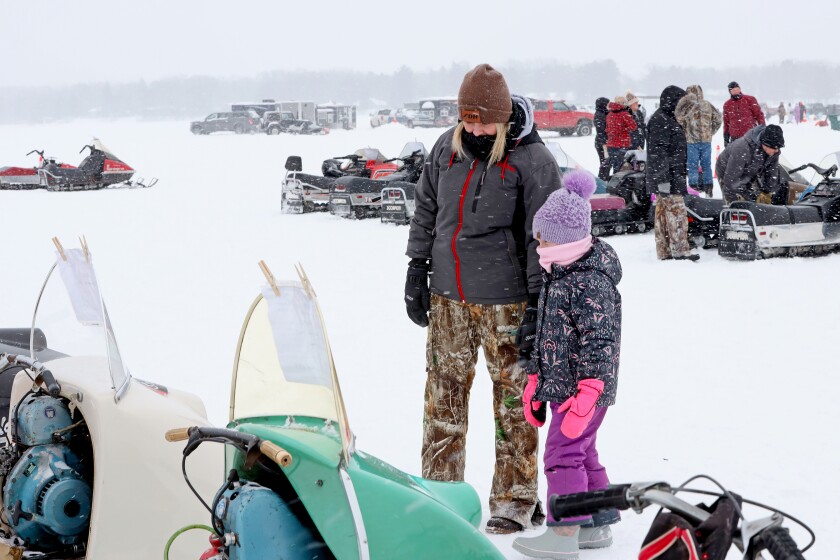 Scorpion snowmobiles and their owners gather on Serpent Lake during the 18th annual Cuyuna Lakes Ice Fishing Contest and Scorpion Homecoming.