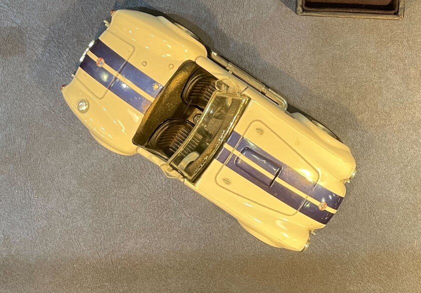 Overhead view of a yellow toy sports car.