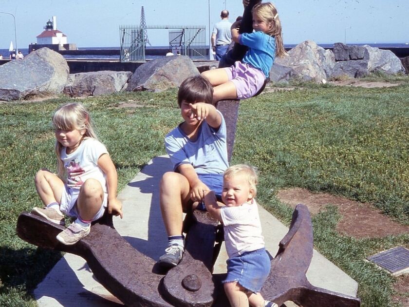 Four children, including DNT reporter Jay Gabler, sit on an anchor in Canal Park