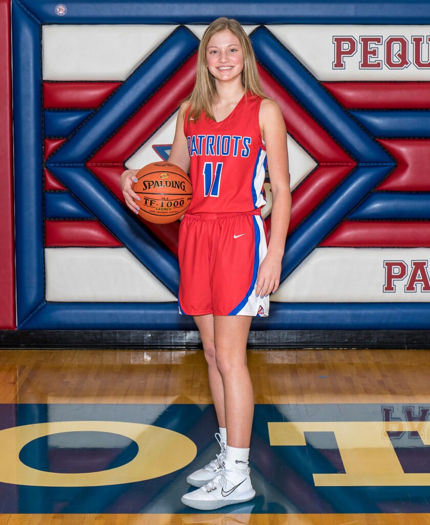 Maci Martini poses in her Patriots Basketball Jersey..jpg