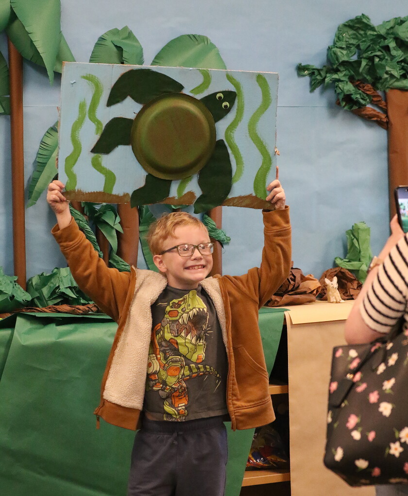 Year-End Projects - Jamestown Sun 11 Greysen Velek proudly holds up his creation of a green sea turtle while being photographed.