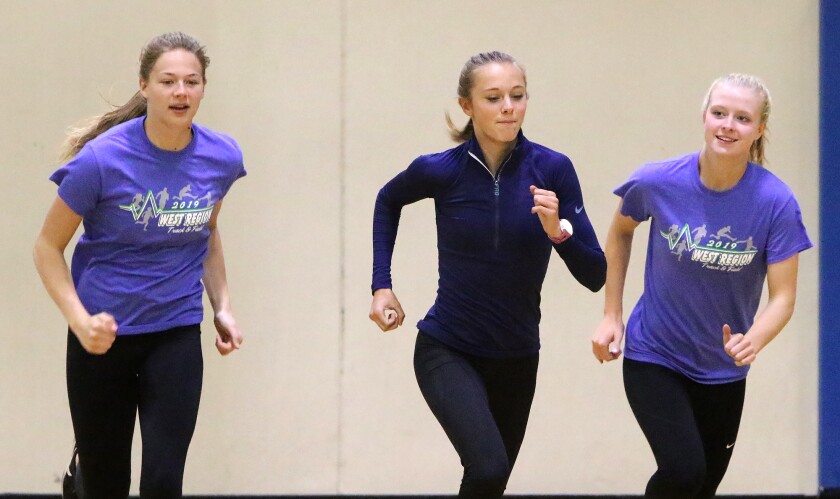 Jamestown sophomore Grace Hegerle (left), sophomore Meghan Ford (middle) and junior Kameron Selvig (right) run on Wednesday, May 22, during track and field practice at Jerry Meyer Arena. John M. Steiner / The Sun