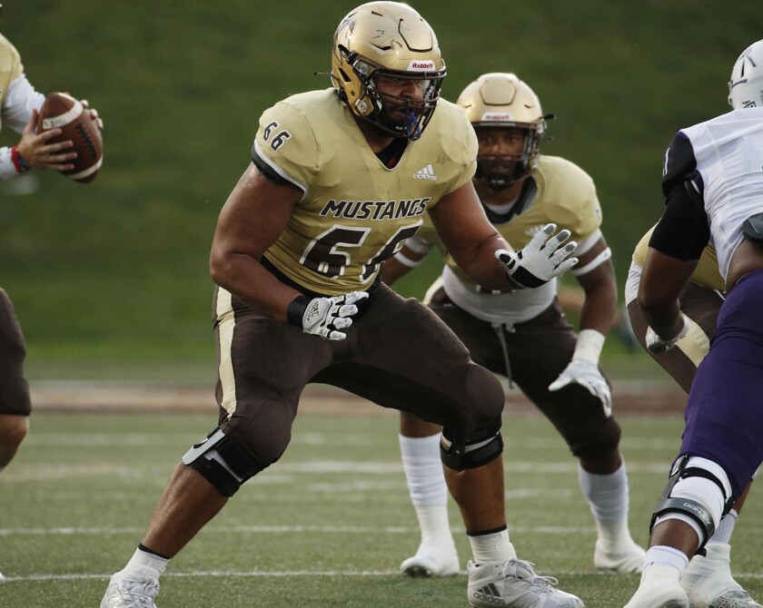Lineman blocks for quarterback