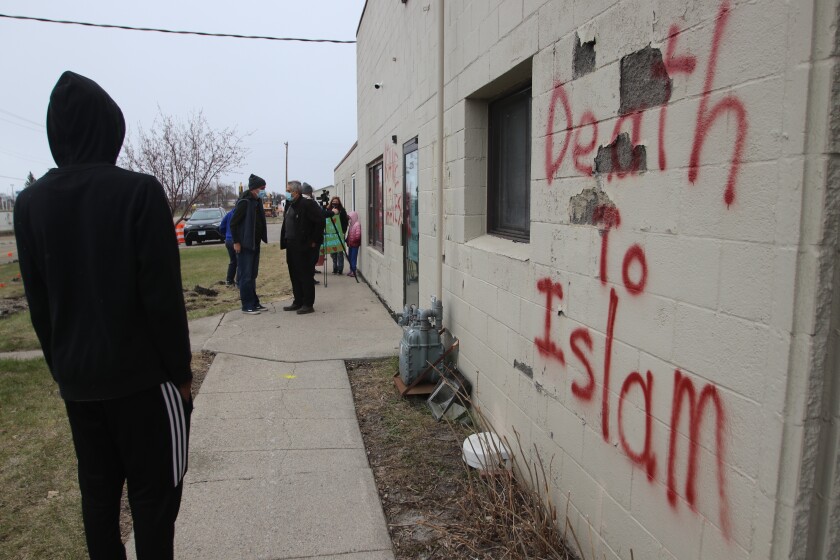 As snow and rain started to fall on Sunday, April 25, dozens of concerned citizens from many different religions rallied to the Moorhead Fargo Islamic Center in support after the mosque was vandalized by hate spee.jpg