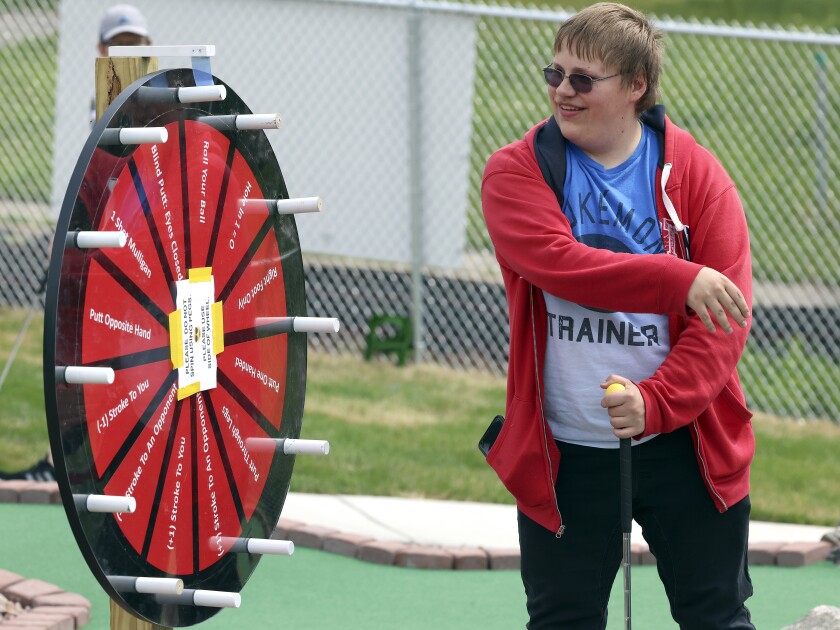 Man spinning a wheel of chance