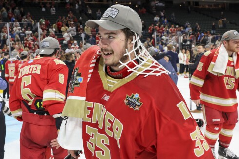 college men play ice hockey