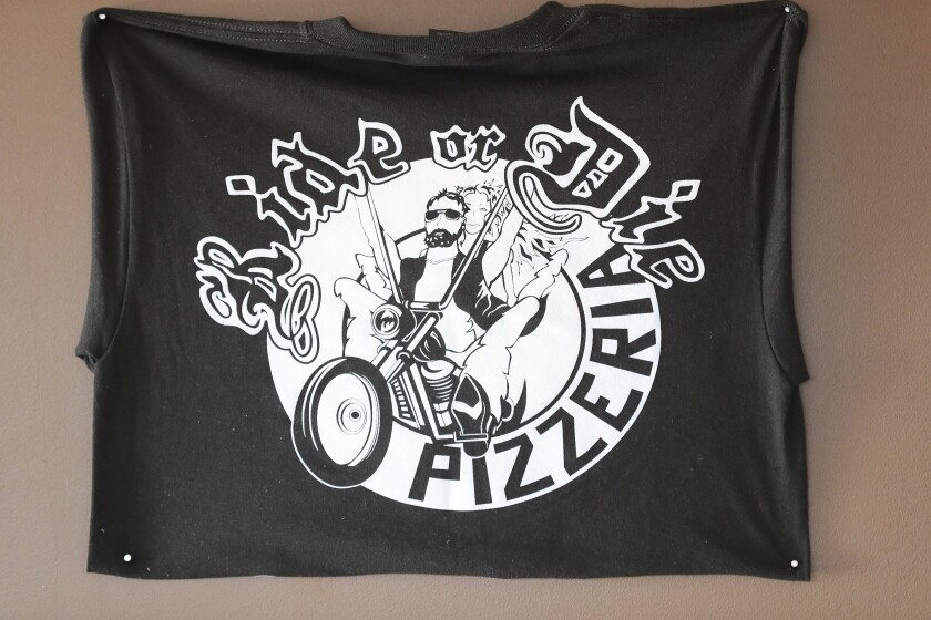Logo on shirt in pizza restaurant