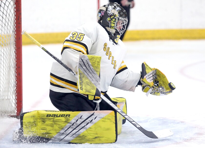 UW-Superior goalie Myles Hektor (35) makes a glove save in the second period
