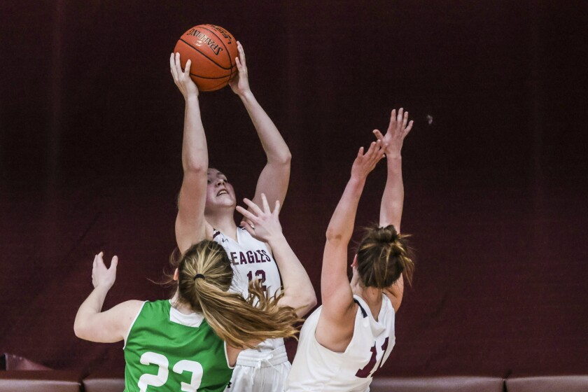 high school girls playing basketball