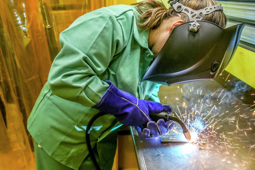 Duluth Denfeld High School student Clarissa Smith, 17, welds at the Denfeld High School fabrication lab on Wednesday, Dec. 7, 2016. (Clint Austin / caustin@duluthnews.com)