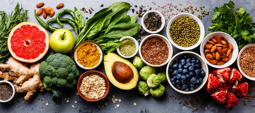 A mix of healthy fruits and vegetables and nuts and seeds.