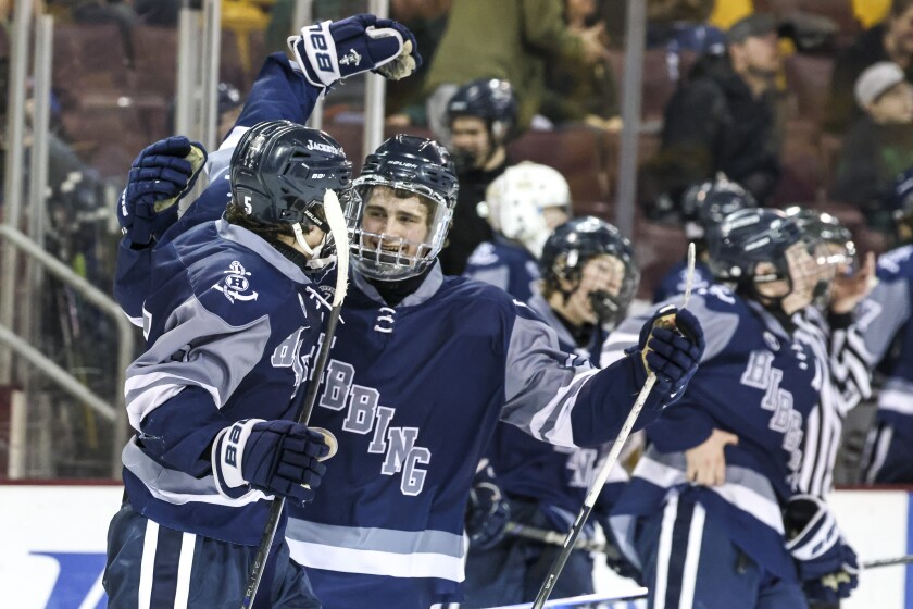 high school boys play ice hockey