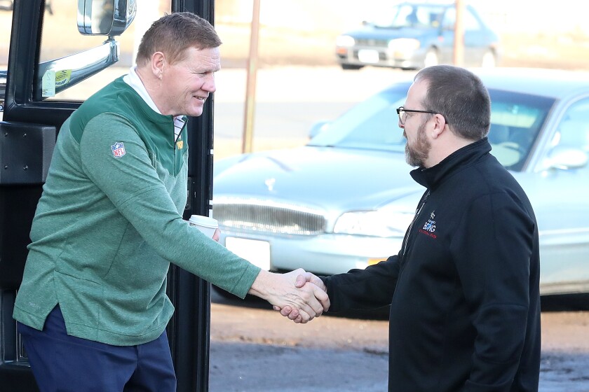 Men shake hands.