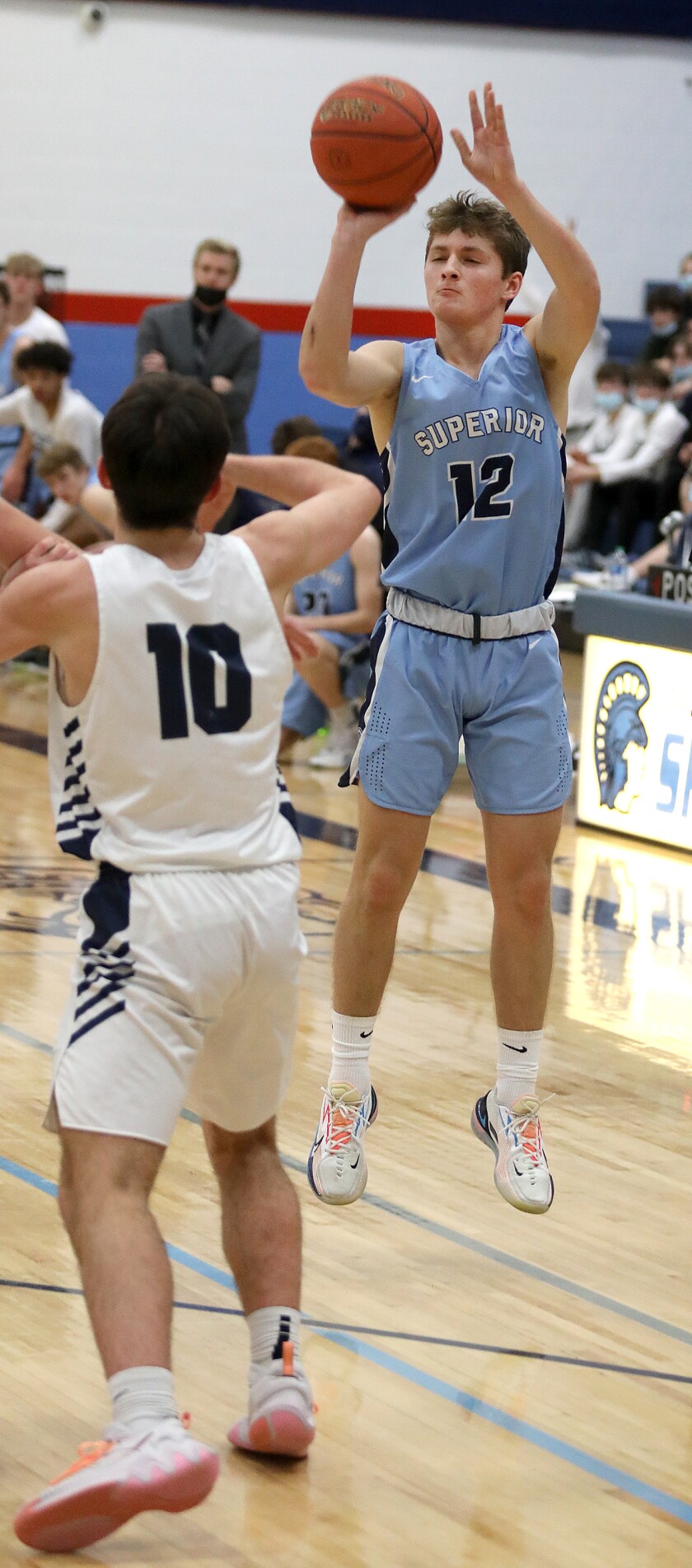 Superior’s Shane Leask (12) connects on a three pointer