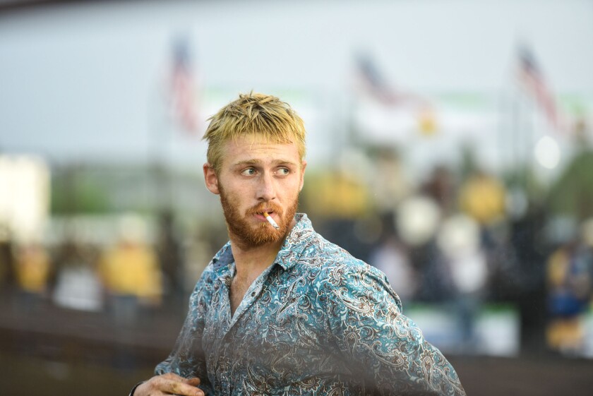 Photos: Fans, riders brave slight rain during Wojo's Rodeo at Beltrami ...