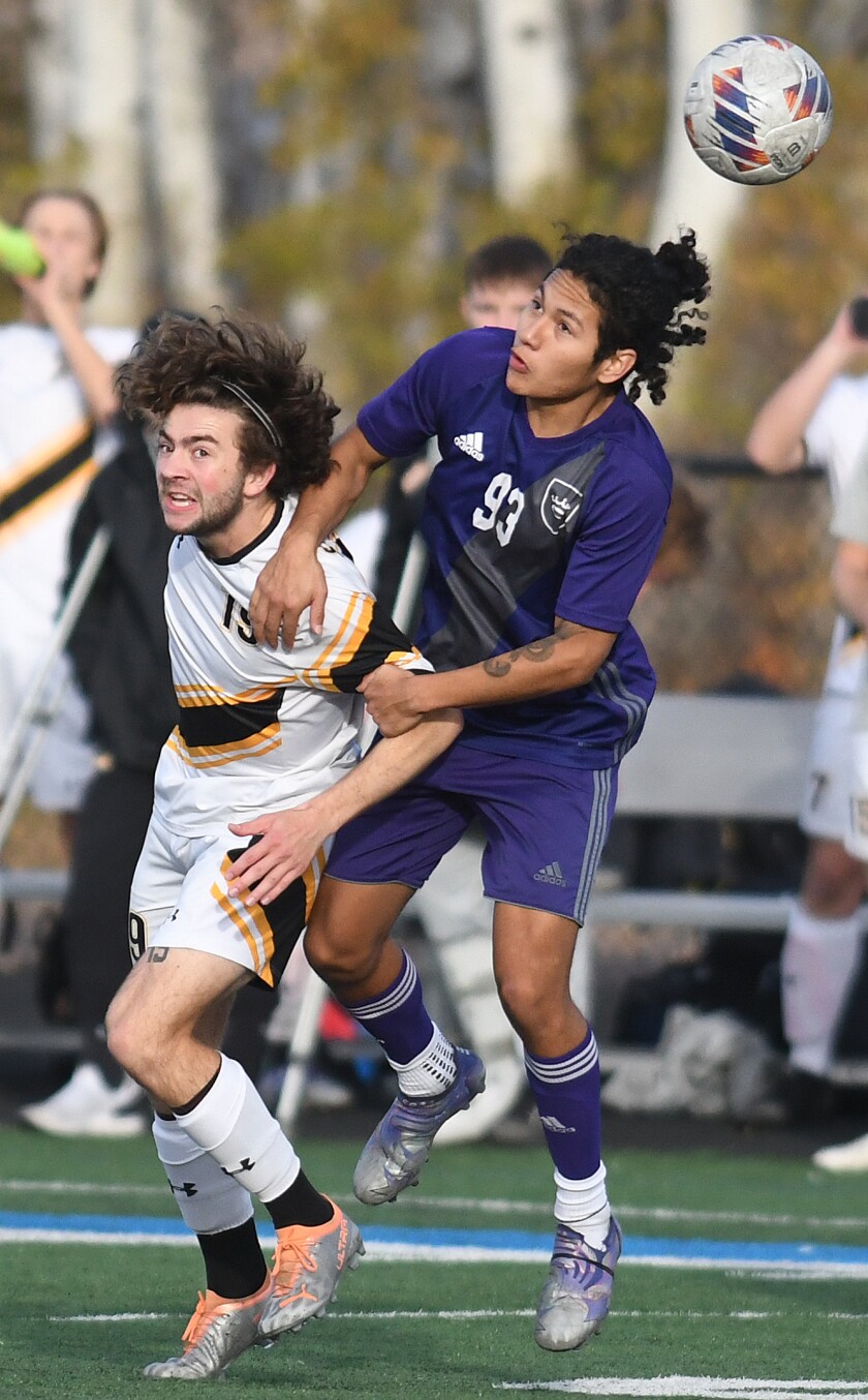 Crown’s Jose Lovera (93) grabs a hold of UW-Superior’s Blake Perry (19) as they fight for position