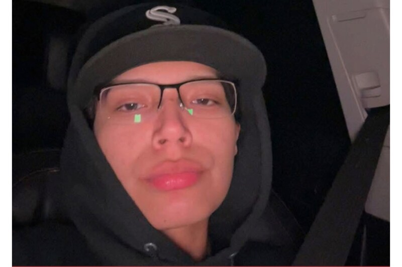 Danica Taylor White, a Native American woman with long dark hair, wearing a black top.