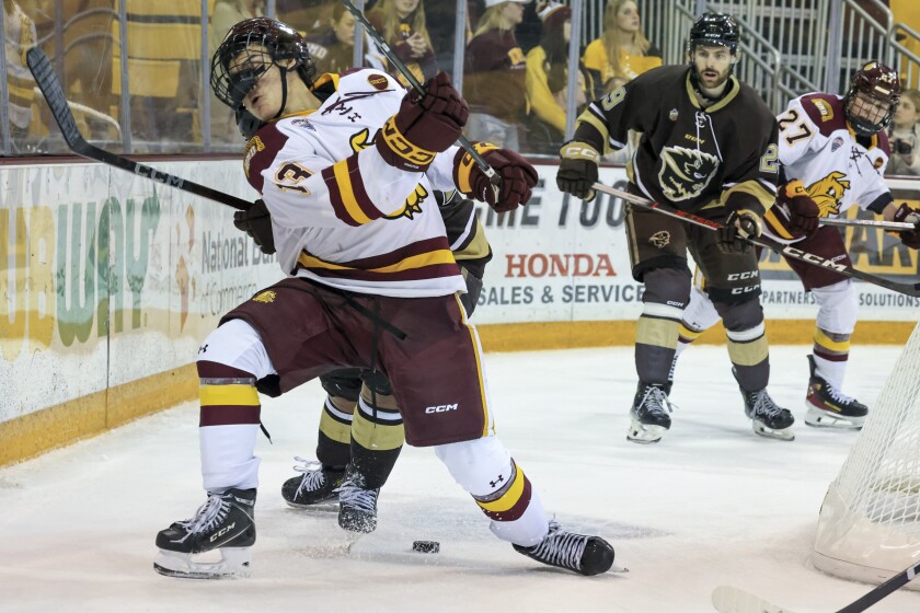 college men play ice hockey