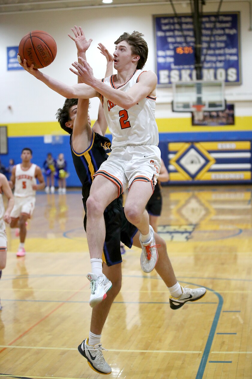 A player shoots a layup.