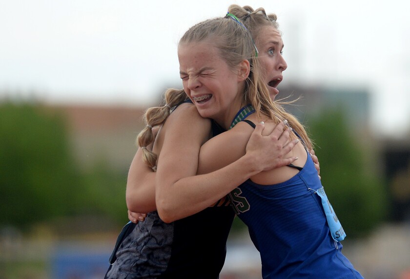 061422.S.WCT.Minnewaska track McKenzie Luetmer hug.jpg