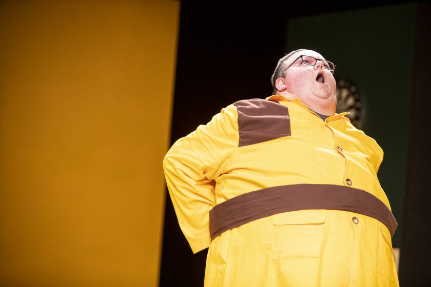 Colonel Mustard, played by Allen Clark, reacts to throwing out his back during a dress rehearsal of "Clue: The Musical" at the Barn Theatre on Thursday, March 24, 2022.