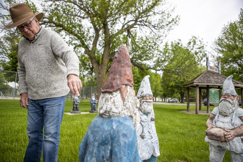 Loren Femrite, who has personally created numerous gnomes Dawson, talks about them while strolling through the city park in Dawson on Tuesday, May 31, 2022.