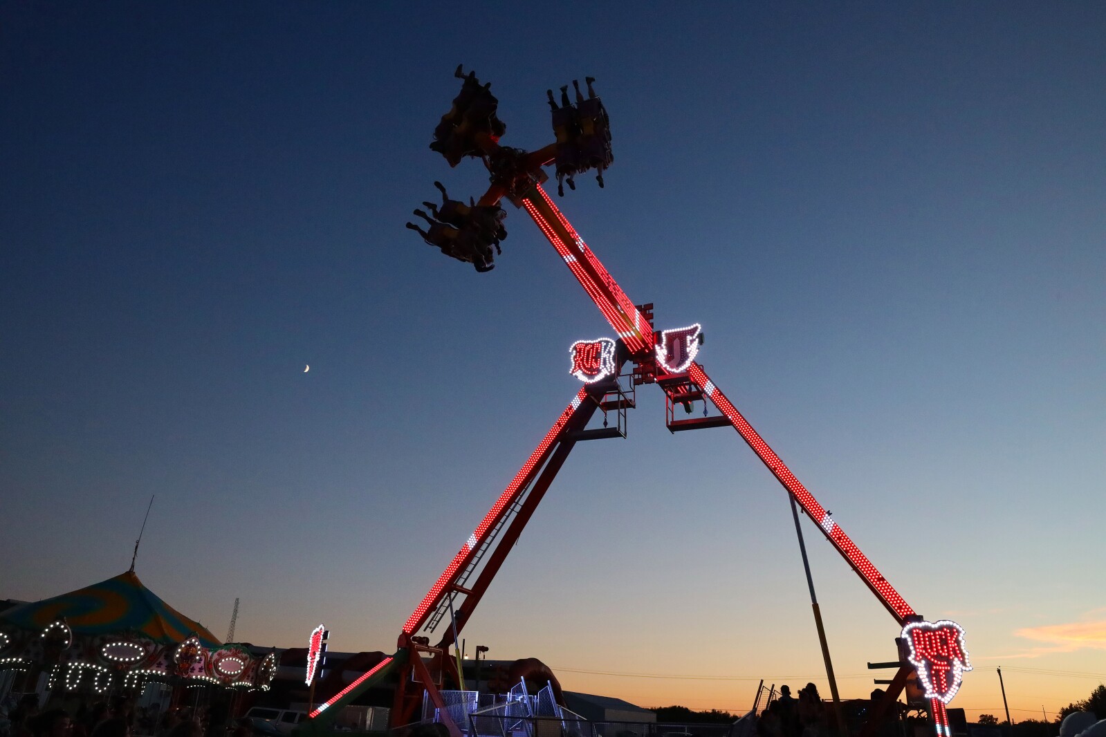 People enjoy the Crow Wing County Fair midway.