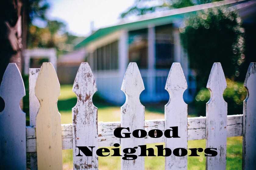 Stock image of a picket fence along a yard