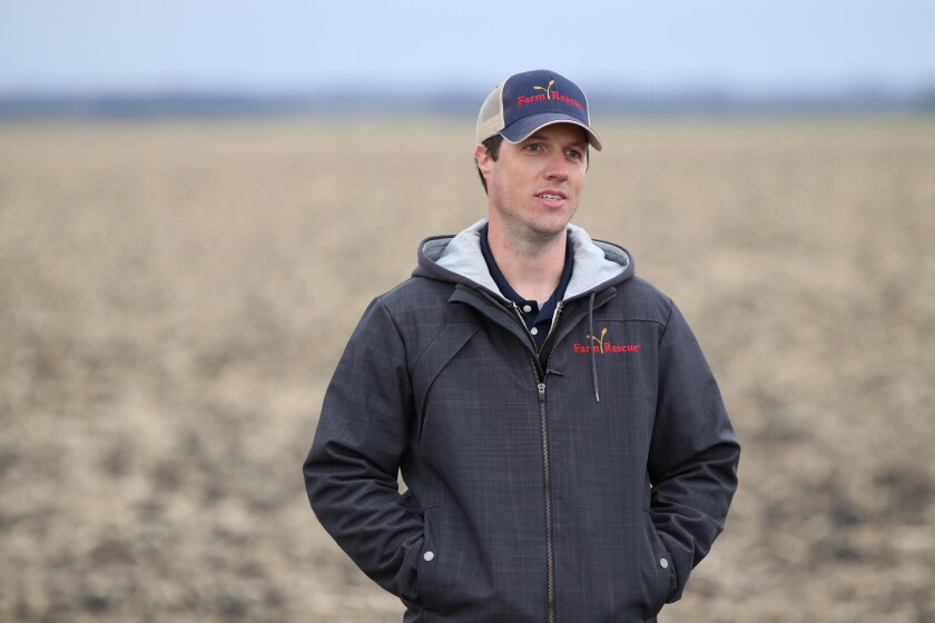 Farm Rescue program manager Dan Erdmann on Robert Nord's ranch on Wednesday, May 5. Farm Rescue helped Nord and his family plant hundreds of acres of corn and soybeans because Nord has suffered injuries and illnes.jpg