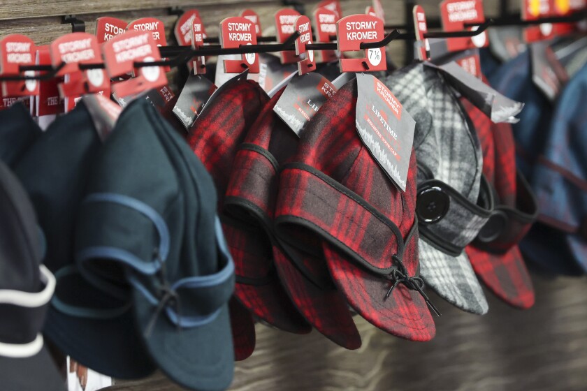 Wool caps with ear bands being made in factory