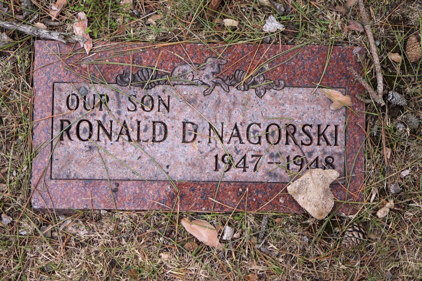 woman documents gravestones
