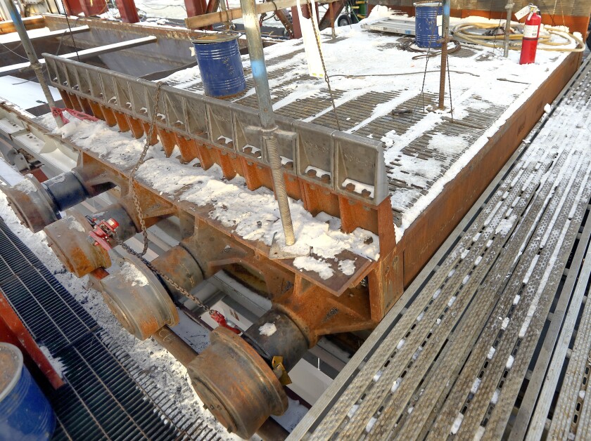 One of the carts that will carry iron ore pellets sits on rails in the partly constructed Mesabi Metallics pelletizing building earlier this month. Steve Kuchera / skuchera@duluthnews.com