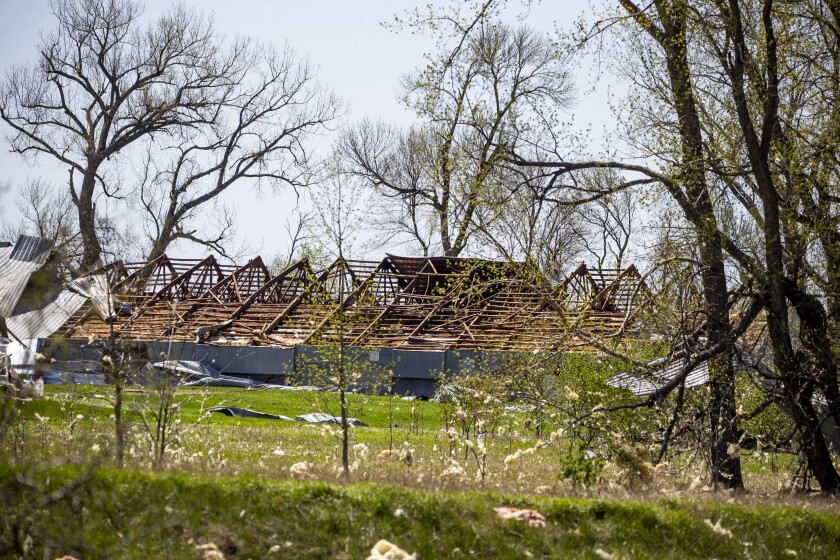A building sits with heavy damage along Highway 12 just west of Murdock on Friday, May 13, 2022, following severe weather that rolled through the region Thursday evening.