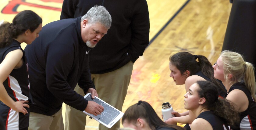 Worthington Trojans head coach Eric Lindner gives instructions to the team during time out in a game with Marshall.