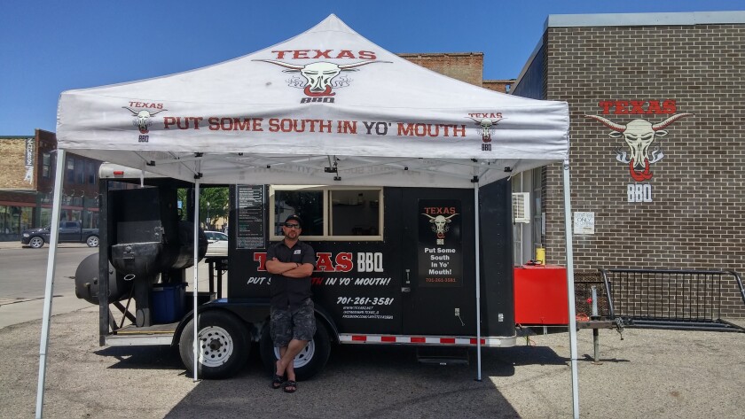 Jason Halvorson, owner of the Texas Q BBQ food truck, poses for a photo at the former Schumacher Goodyear building, 409 Broadway, Fargo. Special to The Forum