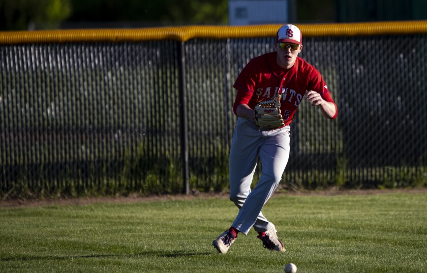KMS outfielder Isaac Rudningen chases down a pop fly as the Fighting Saints took on Paynesville on the road on Thursday, May 26, 2022.
