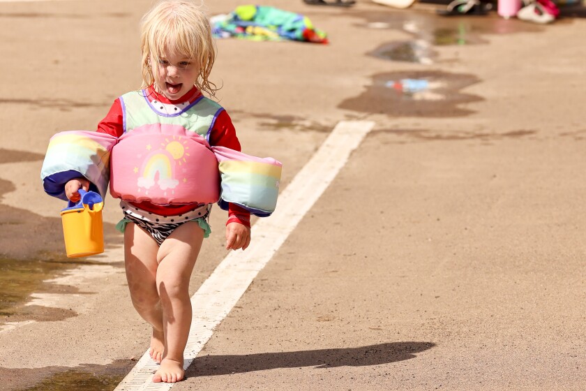 Children playing and swimming at the beach