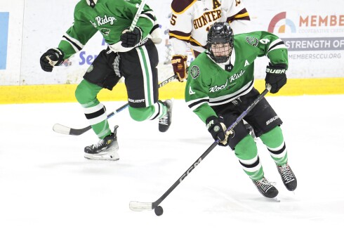 high school boys play ice hockey