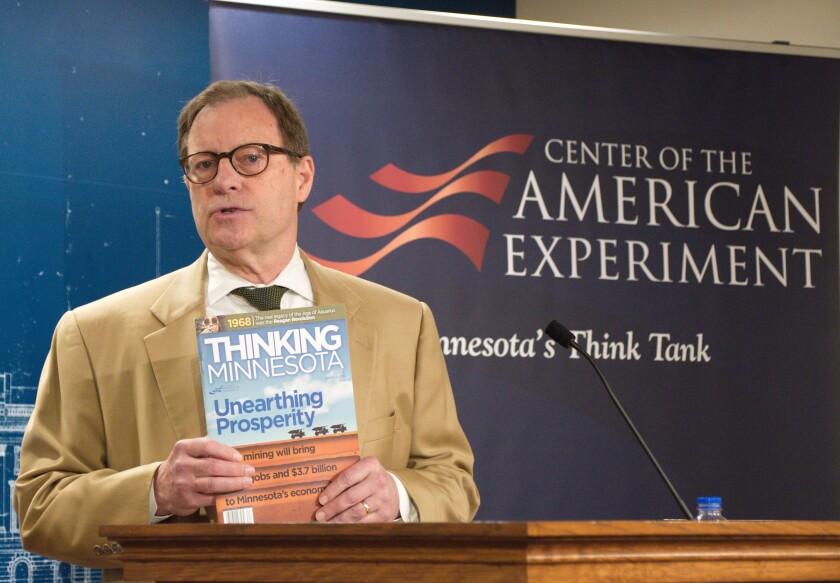 President John Hinderaker of the Center of the American Experience holds a magazine with a story about an August 2018 report that shows copper-nickel mines in northern Minnesota would be good for the economy. Don Davis / Forum News Service