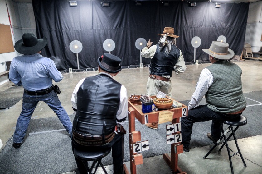 Participants shoot their guns at targets during the Black River Bandits Cowboy Fast Draw Club competition at the Superior Fairgrounds on April 14. Clint Austin / caustin@duluthnews.com