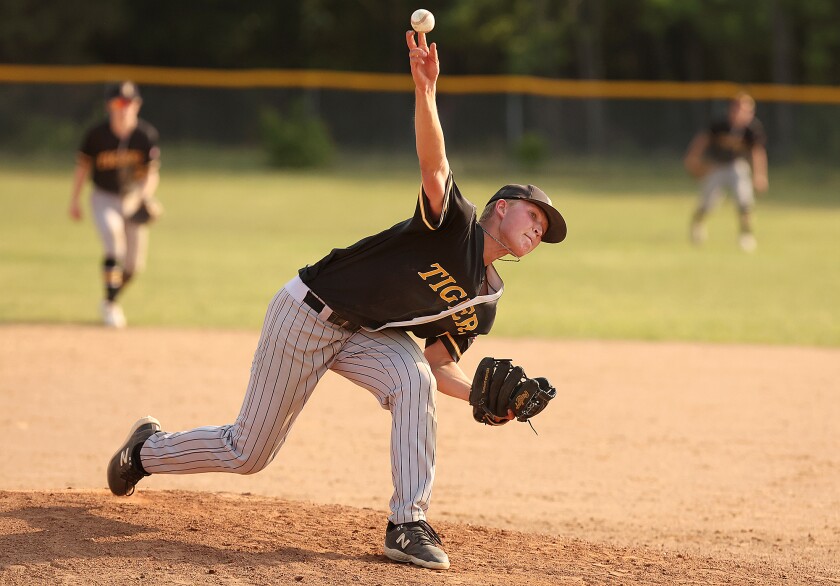 Pitcher throws ball.